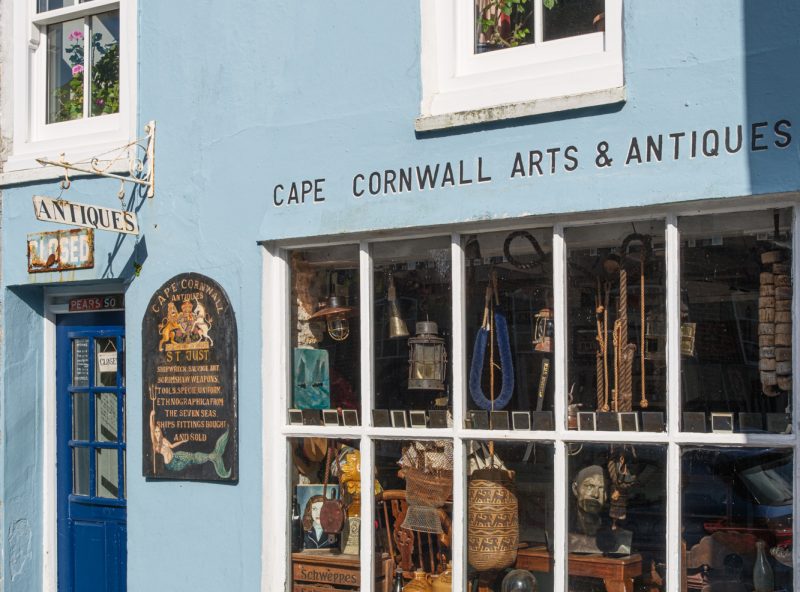 Morning sunlight on the exterior of Cape Cornwall Arts & Antiques on Cape Cornwall Street, St Just