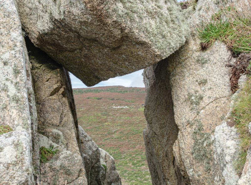Suspended boulder over a narrow path on Pen Nanven with Bosorne Common beyond, Cot Valley 04_10_24