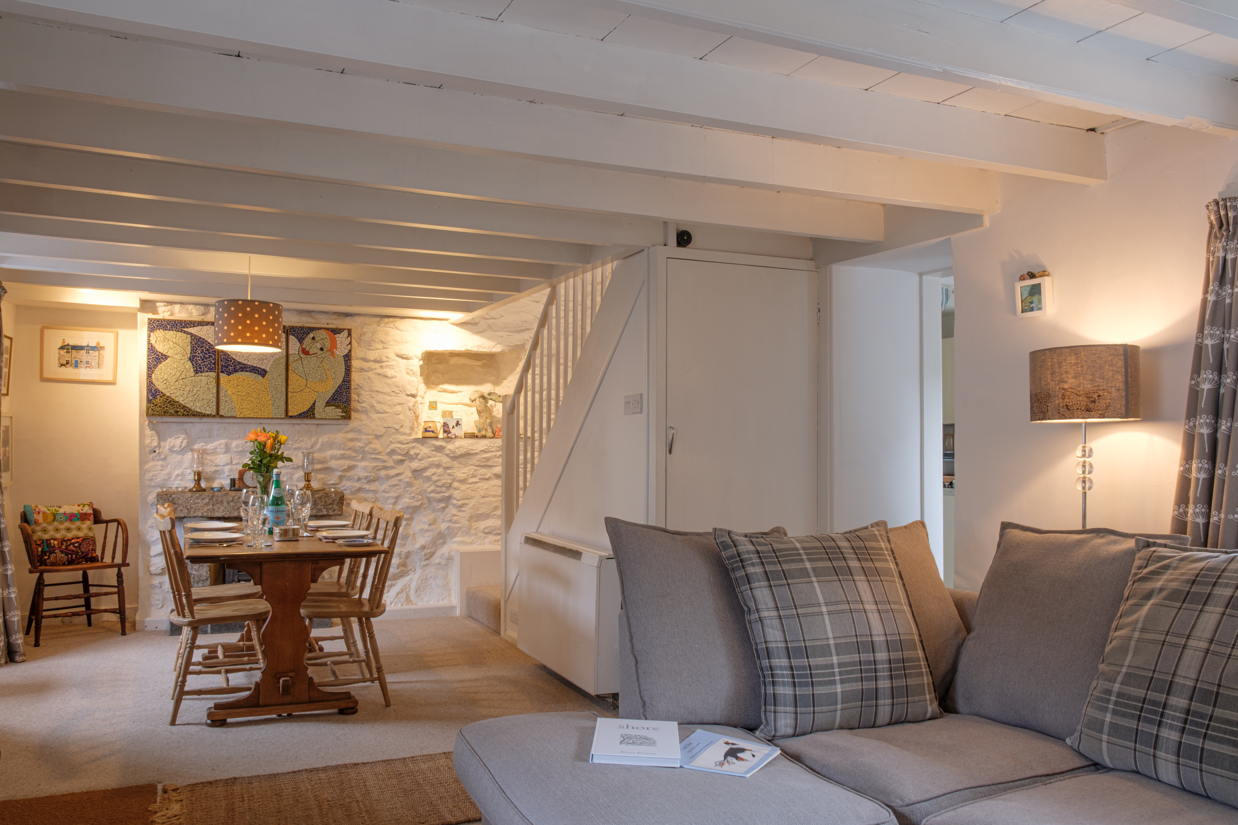 The dining area and sitting room in Banjo Cottage on Cape Cornwall Street, St Just 30_09_24-3 (2500px)